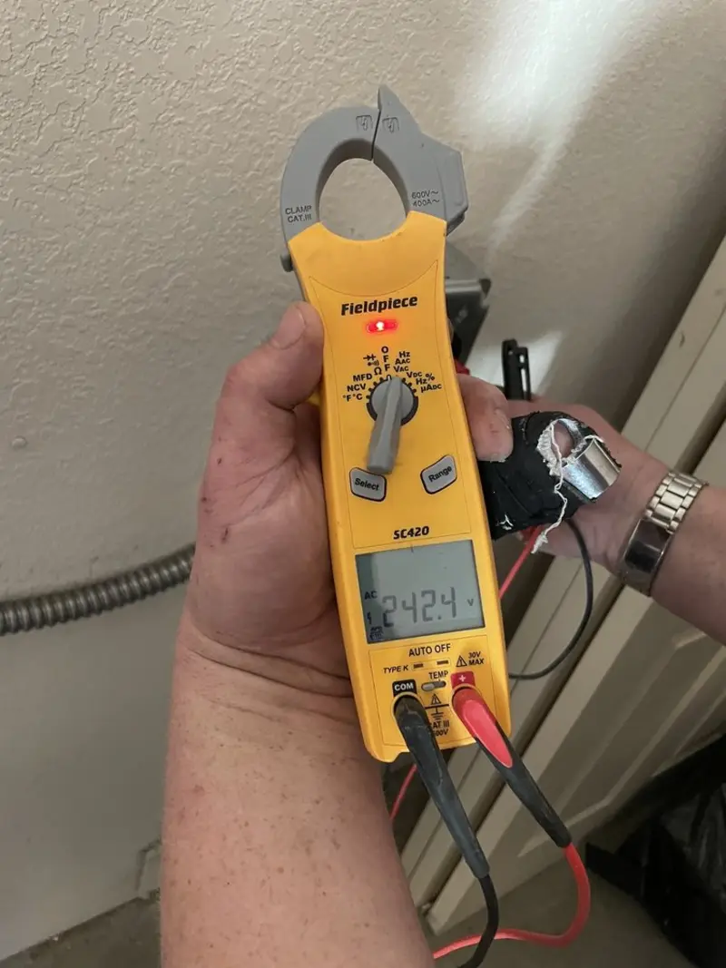 Voltage testing with clamp meter during Ceiling Fan Installation in Scott City